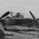 Burned wreckage of US Air Force EC-130, with an abandoned Sea Stallion behind (Author unknown)